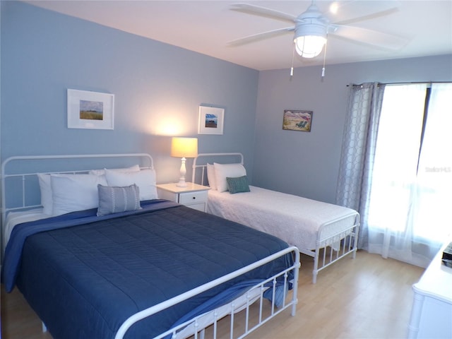 1801 Gulf Dr N Unit 207, Bradenton Beach, FL 34217 - bedroom with light wood-type flooring and a ceiling fan