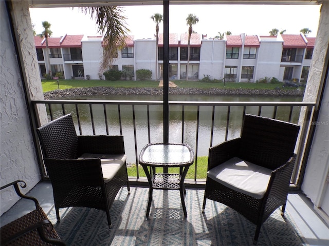 1801 Gulf Dr N Unit 207, Bradenton Beach, FL 34217 - balcony featuring a water view