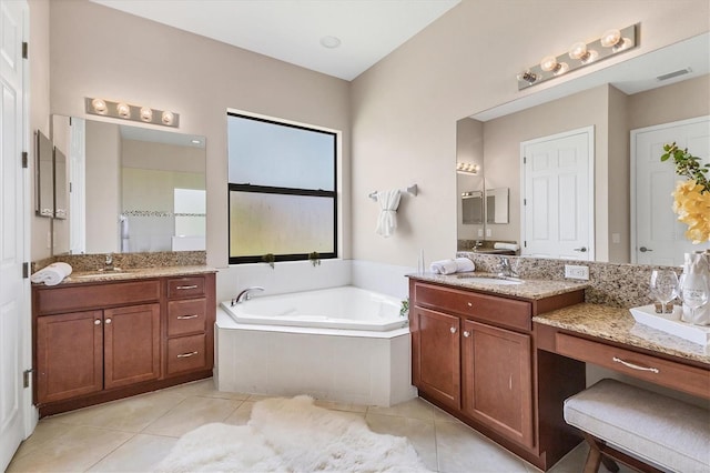 13503 22nd Ct E, Parrish, FL 34219 - full bathroom with tile patterned floors, a bath, and two vanities