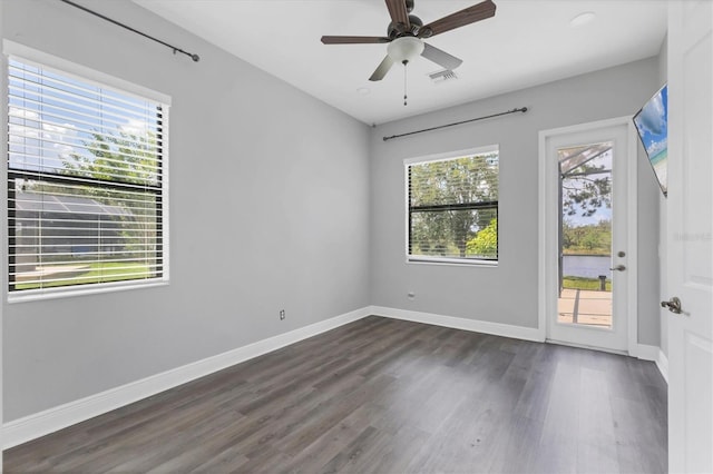 13503 22nd Ct E, Parrish, FL 34219 - spare room featuring dark wood-style floors, ceiling fan, and recessed lighting