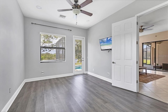 13503 22nd Ct E, Parrish, FL 34219 - spare room featuring a ceiling fan and dark wood finished floors