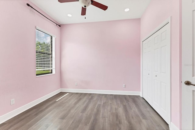 13503 22nd Ct E, Parrish, FL 34219 - unfurnished bedroom with wood finished floors, a closet, a ceiling fan, and recessed lighting