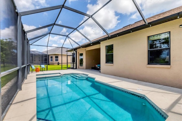 13503 22nd Ct E, Parrish, FL 34219 - view of swimming pool with a patio area, glass enclosure, and a pool with connected hot tub