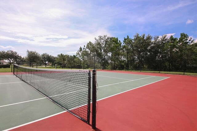 13503 22nd Ct E, Parrish, FL 34219 - view of tennis court with community basketball court and view of scattered trees