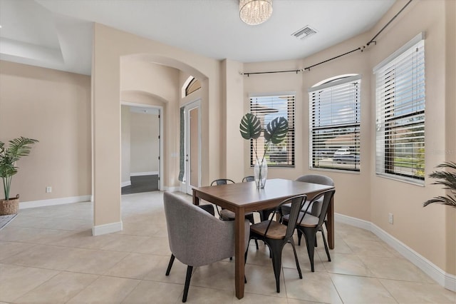 13503 22nd Ct E, Parrish, FL 34219 - dining room featuring arched walkways and light tile patterned flooring