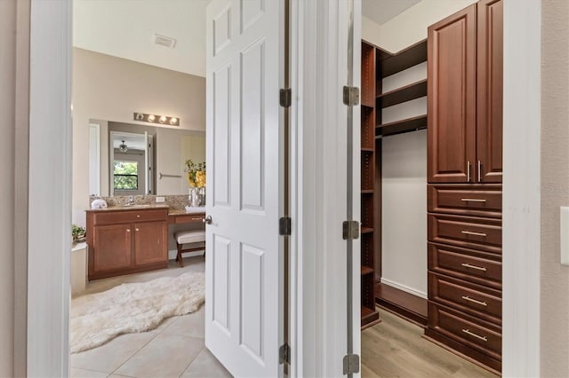 13503 22nd Ct E, Parrish, FL 34219 - walk in closet featuring a sink and light tile patterned floors