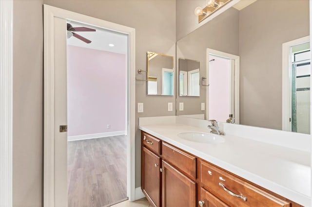 13503 22nd Ct E, Parrish, FL 34219 - bathroom with vanity, ceiling fan, and wood finished floors
