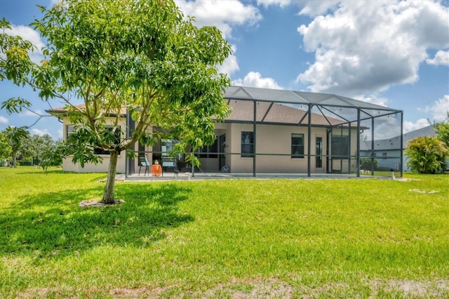13503 22nd Ct E, Parrish, FL 34219 - back of property with a lawn and glass enclosure