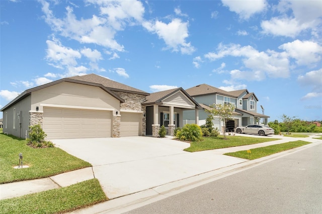 2108 Citrus Breeze Dr, Bradenton, FL 34208 - view of front facade featuring stone siding, an attached garage, a front yard, and concrete driveway