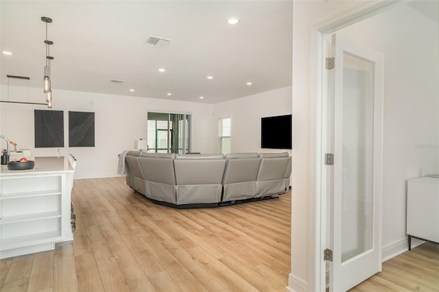 2108 Citrus Breeze Dr, Bradenton, FL 34208 - living area featuring light wood-style floors and recessed lighting