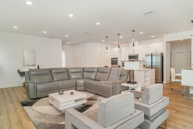 2108 Citrus Breeze Dr, Bradenton, FL 34208 - living room featuring recessed lighting and light wood-type flooring