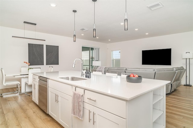 2108 Citrus Breeze Dr, Bradenton, FL 34208 - kitchen with white cabinets, light wood-style flooring, open shelves, an island with sink, and recessed lighting