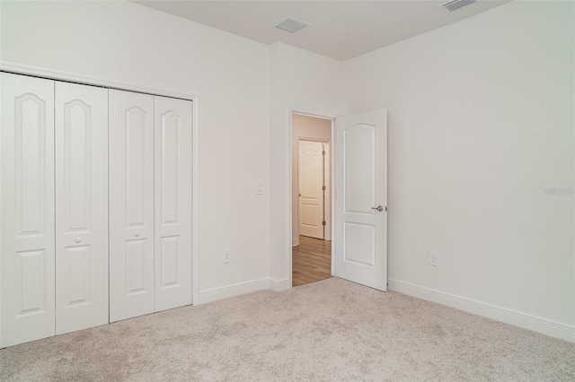 2108 Citrus Breeze Dr, Bradenton, FL 34208 - unfurnished bedroom with carpet floors and a closet