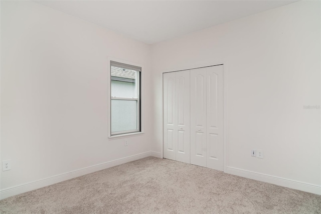 2108 Citrus Breeze Dr, Bradenton, FL 34208 - unfurnished bedroom with carpet and a closet