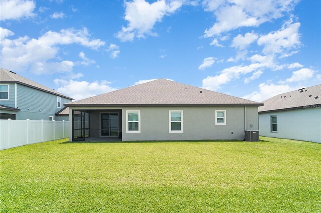2108 Citrus Breeze Dr, Bradenton, FL 34208 - back of house with a sunroom, stucco siding, and roof with shingles