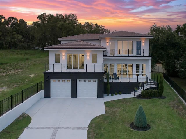 1841 Moorings Ct, Clermont, FL 34711 - contemporary home featuring a balcony, concrete driveway, stairs, a garage, and stucco siding