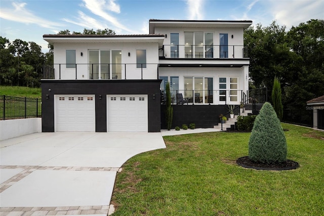 1841 Moorings Ct, Clermont, FL 34711 - view of front of home featuring a balcony, stairway, concrete driveway, a garage, and stucco siding