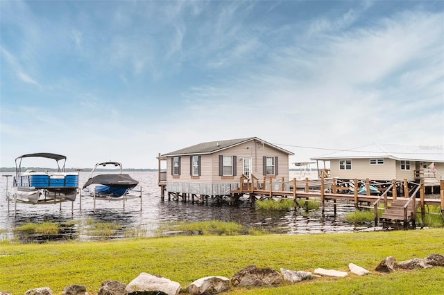 1841 Moorings Ct, Clermont, FL 34711 - dock featuring a water view, boat lift, and a yard