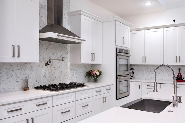 1841 Moorings Ct, Clermont, FL 34711 - kitchen featuring wall chimney range hood, appliances with stainless steel finishes, backsplash, and white cabinets