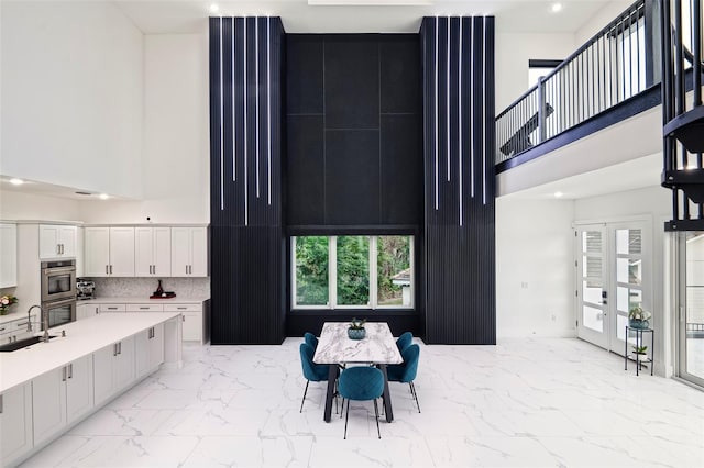 1841 Moorings Ct, Clermont, FL 34711 - dining room with a towering ceiling, light marble finish flooring, and recessed lighting