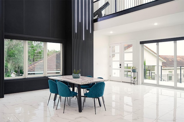 1841 Moorings Ct, Clermont, FL 34711 - dining area with a towering ceiling, light marble finish flooring, and recessed lighting
