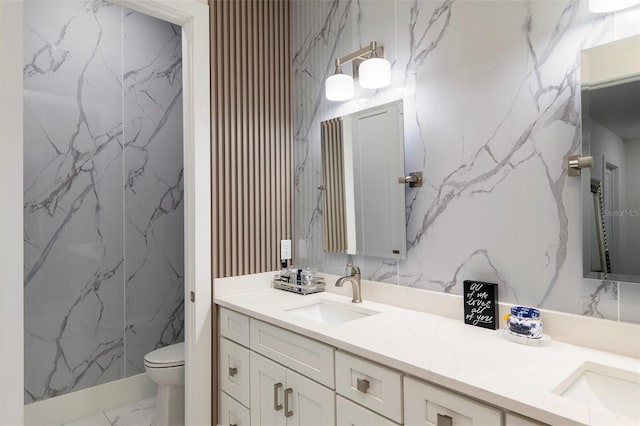 1841 Moorings Ct, Clermont, FL 34711 - bathroom featuring marble finish flooring, double vanity, and stone wall