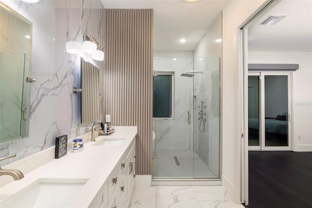 1841 Moorings Ct, Clermont, FL 34711 - ensuite bathroom featuring double vanity, a marble finish shower, marble finish flooring, and recessed lighting