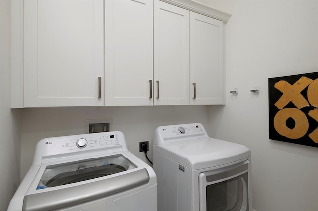 1841 Moorings Ct, Clermont, FL 34711 - laundry area with cabinet space and washing machine and dryer