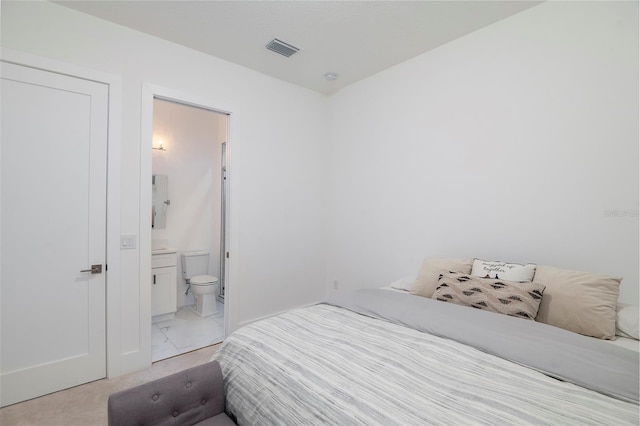 1841 Moorings Ct, Clermont, FL 34711 - bedroom featuring light marble finish floors and ensuite bath