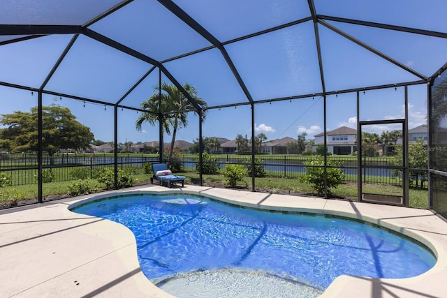 4617 Garden Arbor Way, Bradenton, FL 34203 - view of swimming pool featuring a residential view, a fenced backyard, a patio area, and glass enclosure