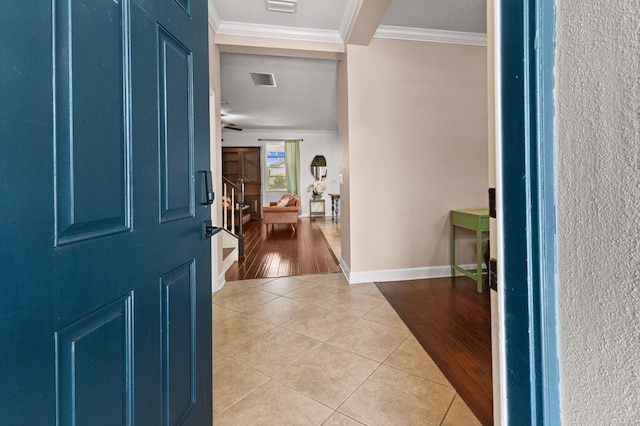 4617 Garden Arbor Way, Bradenton, FL 34203 - foyer with light tile patterned floors, crown molding, and baseboards
