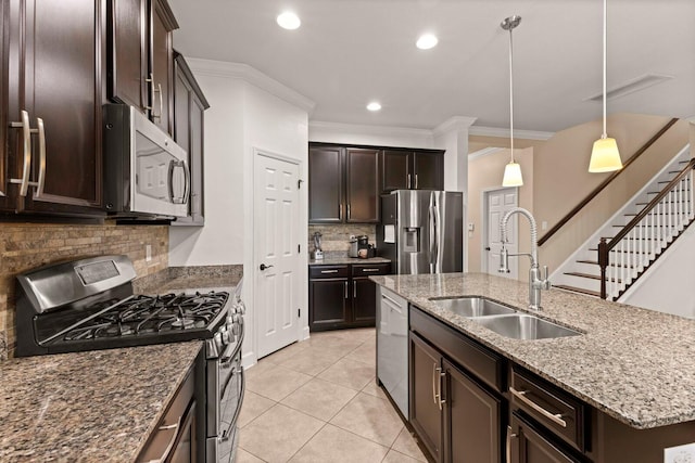 4617 Garden Arbor Way, Bradenton, FL 34203 - kitchen featuring stainless steel appliances, a sink, ornamental molding, decorative backsplash, and an island with sink