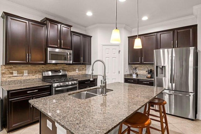 4617 Garden Arbor Way, Bradenton, FL 34203 - kitchen with appliances with stainless steel finishes, a sink, light tile patterned flooring, dark brown cabinetry, and stone countertops