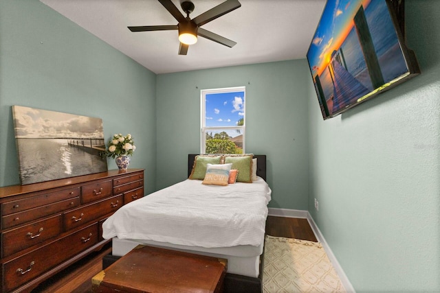 4617 Garden Arbor Way, Bradenton, FL 34203 - bedroom with dark wood-style flooring, baseboards, and a ceiling fan