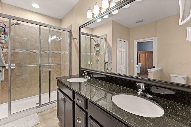 4617 Garden Arbor Way, Bradenton, FL 34203 - bathroom with toilet, a stall shower, double vanity, and tile patterned flooring