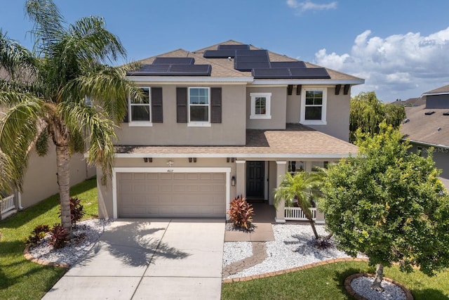 4617 Garden Arbor Way, Bradenton, FL 34203 - view of front facade with concrete driveway, roof with shingles, stucco siding, and a garage