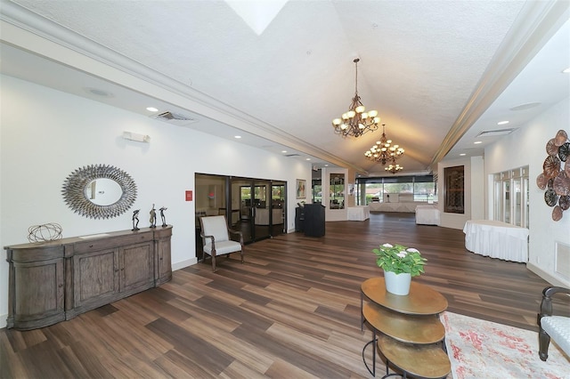 4907 Kilty Ct E, Bradenton, FL 34203 - living room with a chandelier, vaulted ceiling, wood finished floors, and recessed lighting