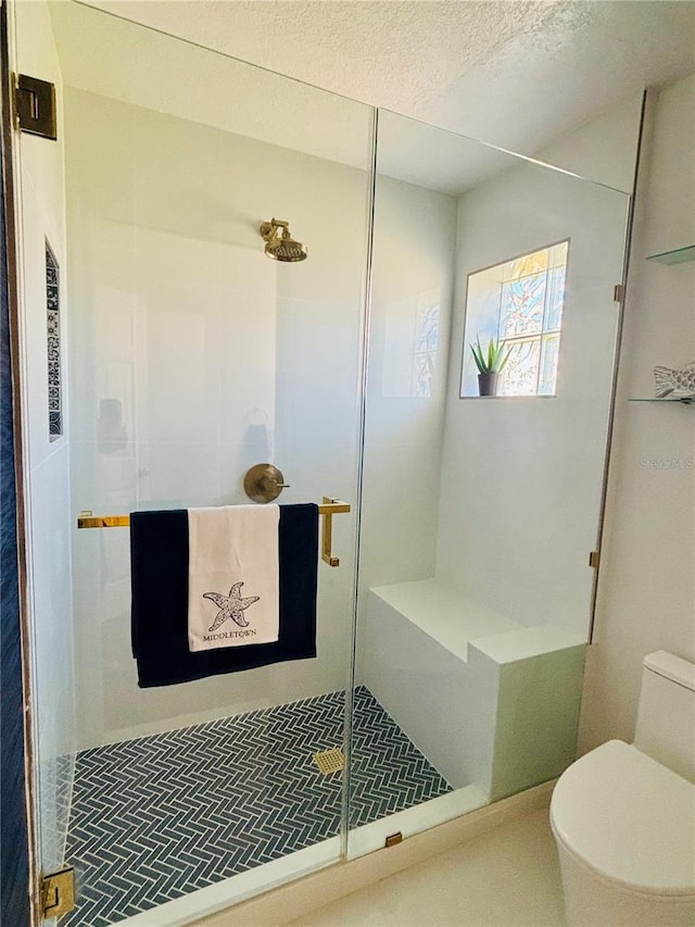 4907 Kilty Ct E, Bradenton, FL 34203 - bathroom with a stall shower and a textured ceiling