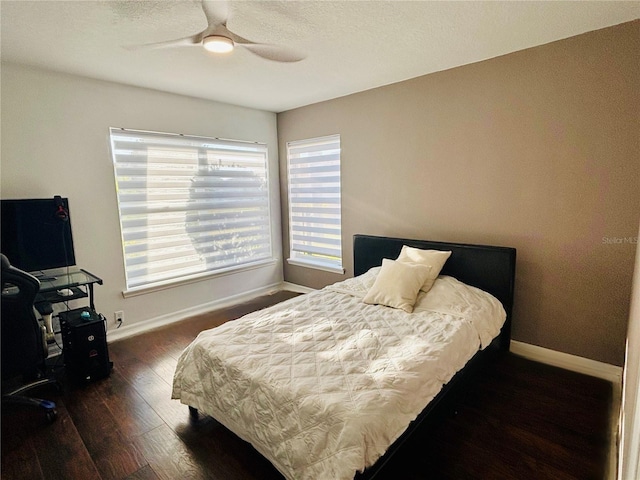 4907 Kilty Ct E, Bradenton, FL 34203 - bedroom with wood finished floors, a ceiling fan, and a textured ceiling