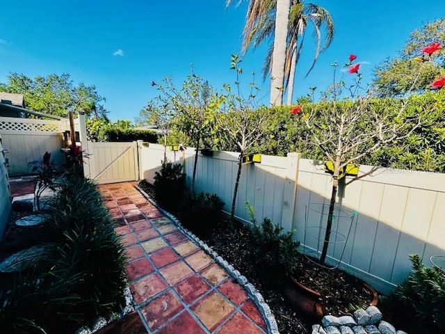 2607 29th Ave W, Bradenton, FL 34205 - fenced backyard featuring a gate