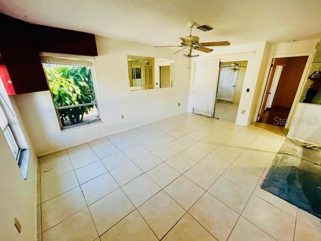 2607 29th Ave W, Bradenton, FL 34205 - spare room with light tile patterned floors and a ceiling fan