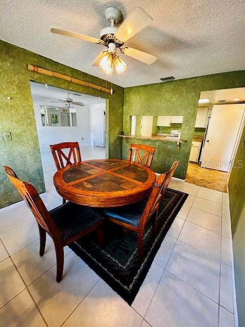 2607 29th Ave W, Bradenton, FL 34205 - tiled dining area with a textured ceiling and ceiling fan