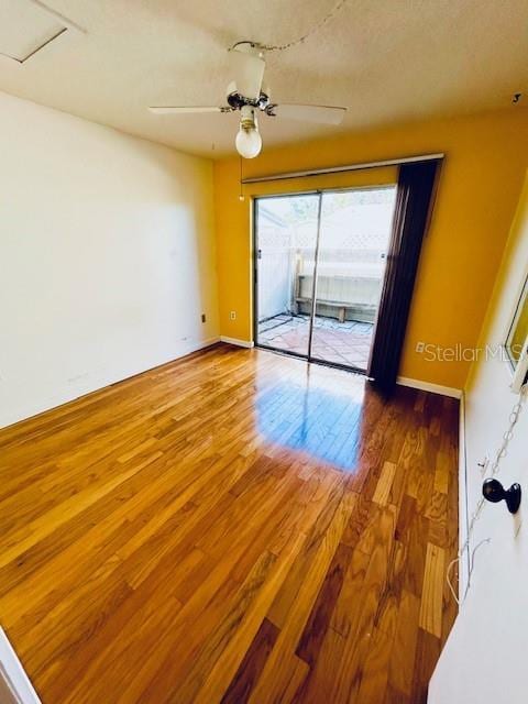 2607 29th Ave W, Bradenton, FL 34205 - empty room featuring wood finished floors, baseboards, and a ceiling fan