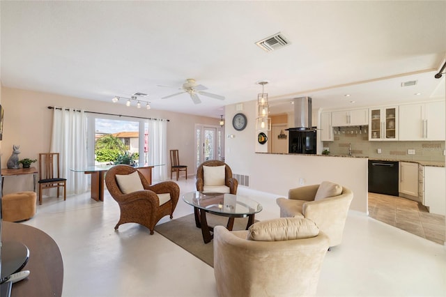 2807 Coral Way, Punta Gorda, FL 33950 - living room featuring a ceiling fan and finished concrete flooring