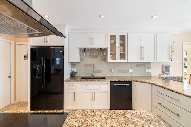 2807 Coral Way, Punta Gorda, FL 33950 - kitchen featuring black appliances, a sink, wall chimney range hood, white cabinetry, and light stone countertops