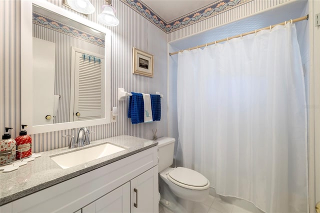 2807 Coral Way, Punta Gorda, FL 33950 - bathroom featuring wallpapered walls, toilet, tile patterned floors, vanity, and a shower with curtain