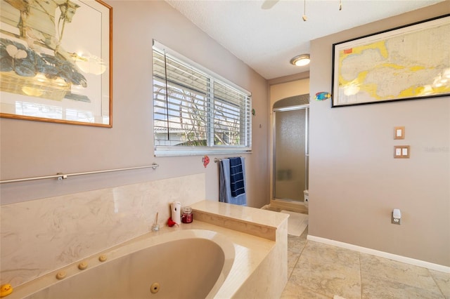 2807 Coral Way, Punta Gorda, FL 33950 - full bath with a shower stall, a tub with jets, tile patterned flooring, and baseboards