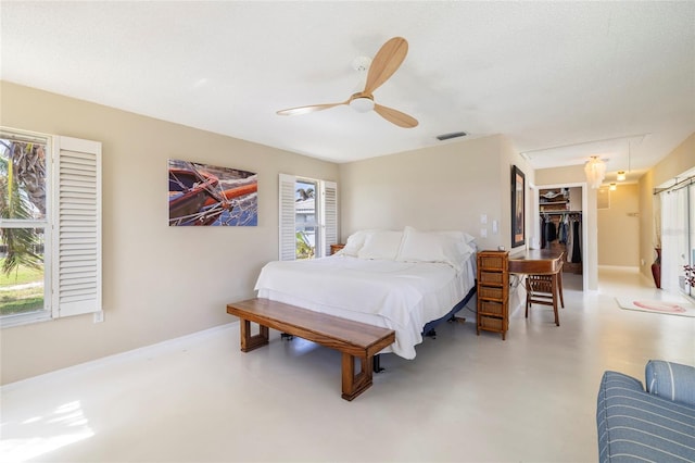 2807 Coral Way, Punta Gorda, FL 33950 - bedroom featuring multiple windows, a spacious closet, a ceiling fan, and a closet