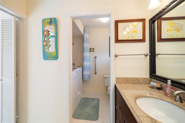 2807 Coral Way, Punta Gorda, FL 33950 - bathroom featuring a closet, tile patterned floors, vanity, and toilet