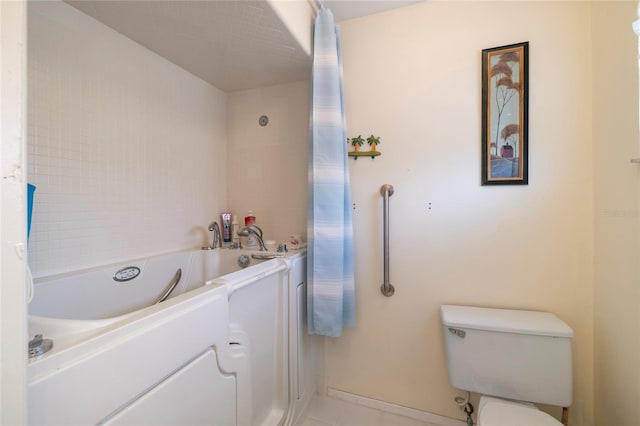 2807 Coral Way, Punta Gorda, FL 33950 - full bath featuring a tub, toilet, and tile patterned flooring